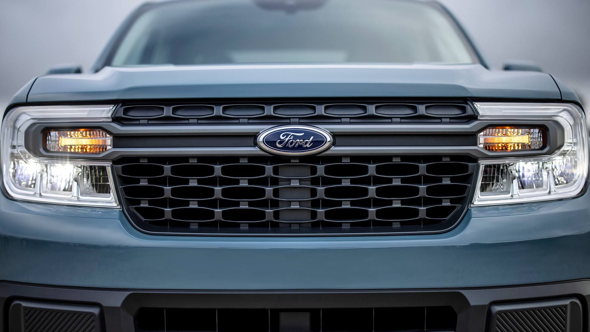 2022 Ford Maverick front grille shown in Hybrid XLT trim with LED lighting.